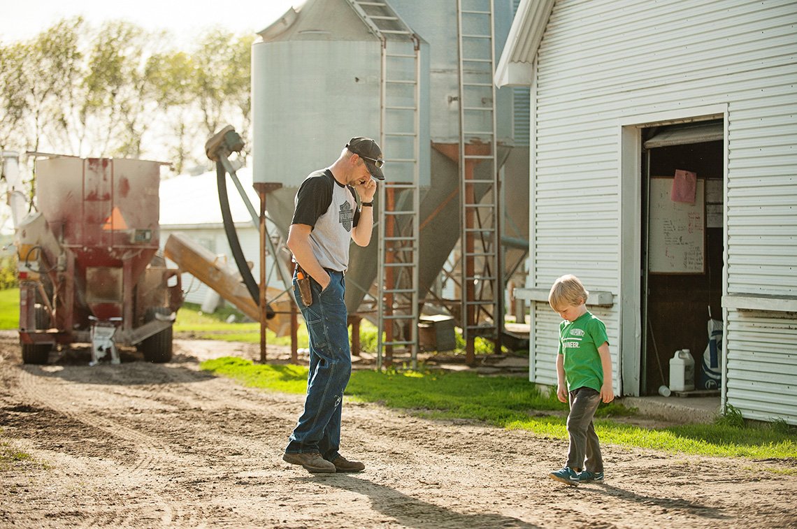 A father and son on the farm near Albert Lea, Minnesota