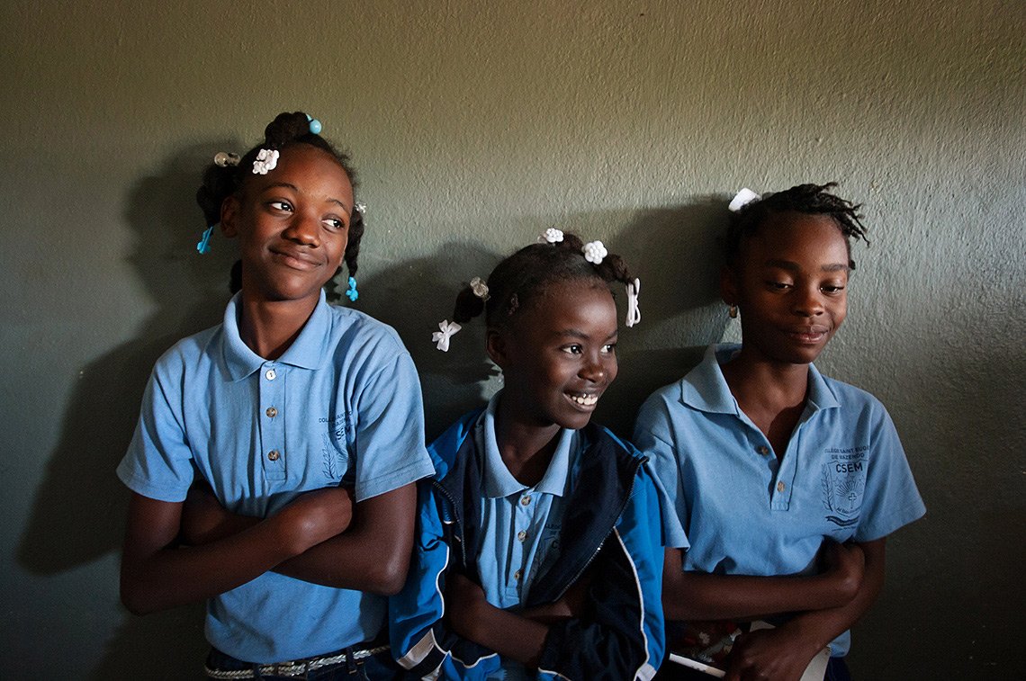 Three girls at a private catholic school in Haiti