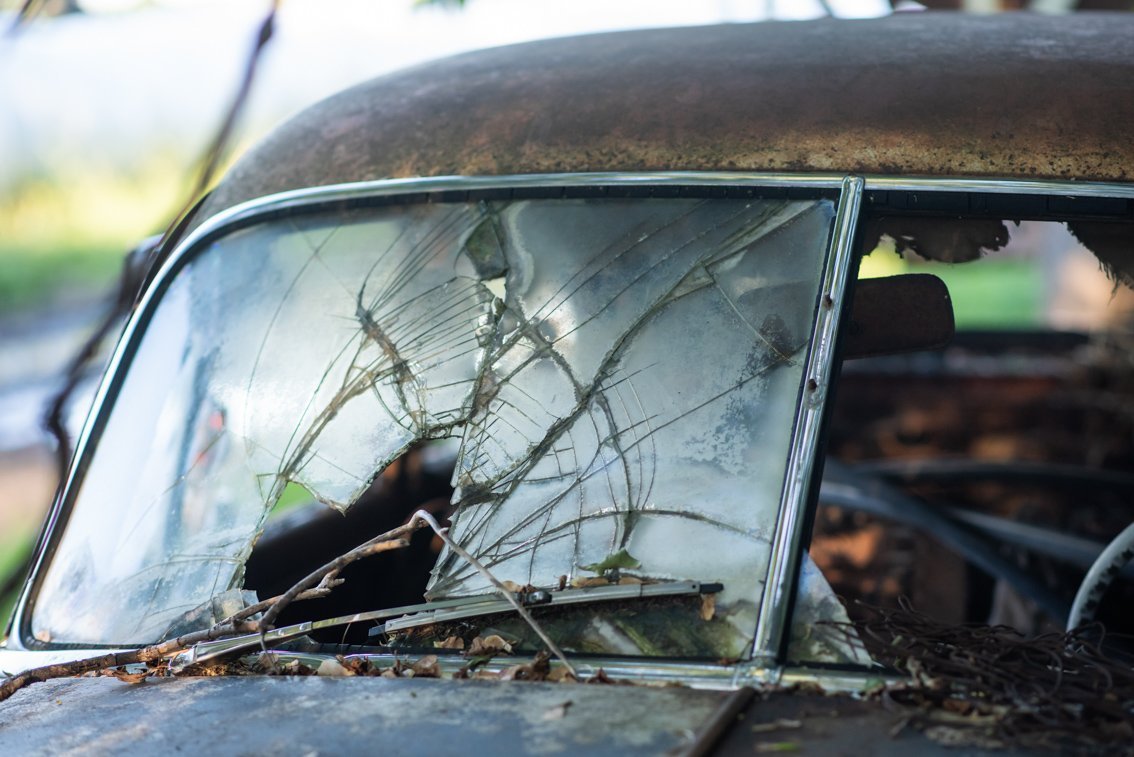 broken windshield of old Chevy Deluxe