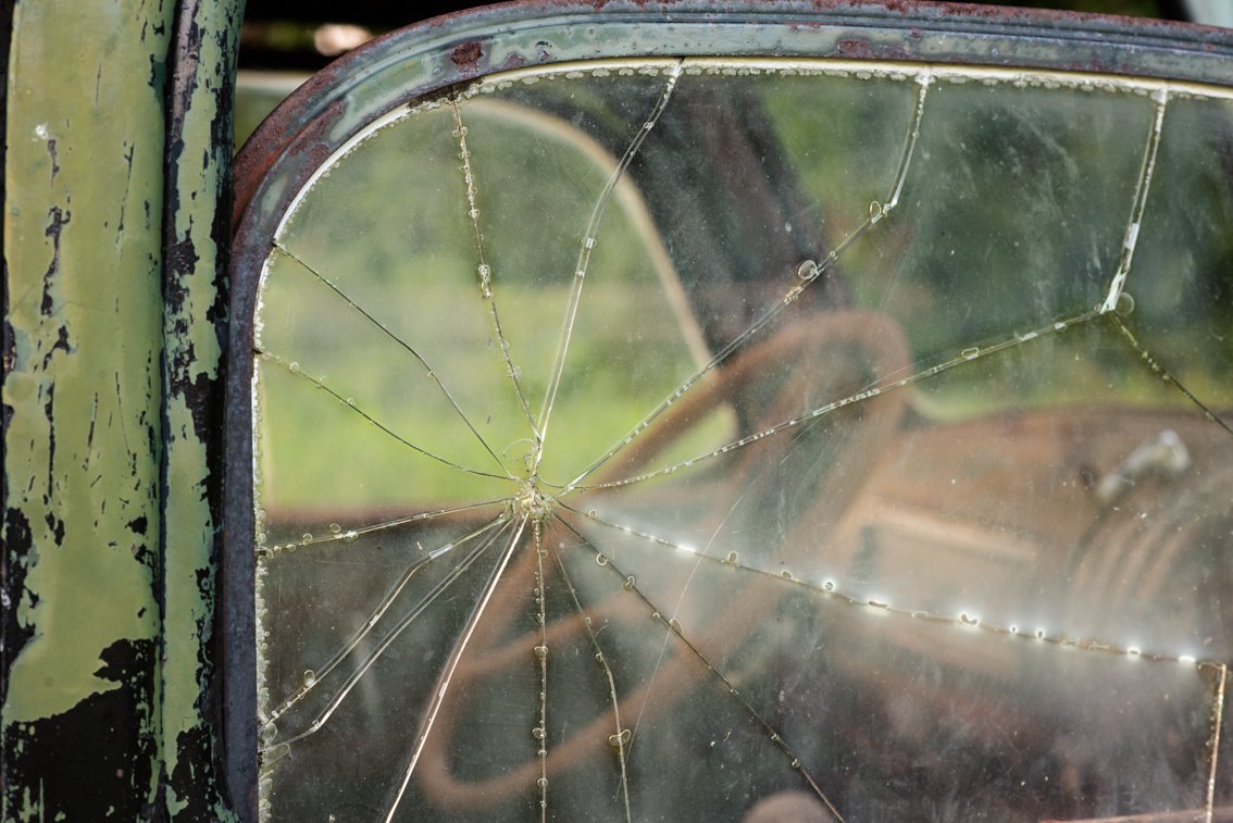 broken window of abandoned Chevy Pickup truck